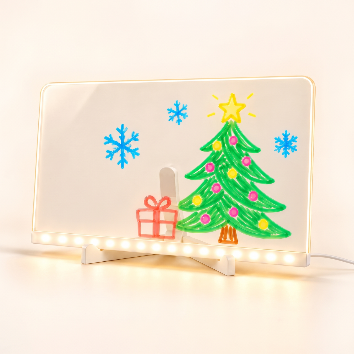 LED drawing board with a glowing Christmas tree drawing