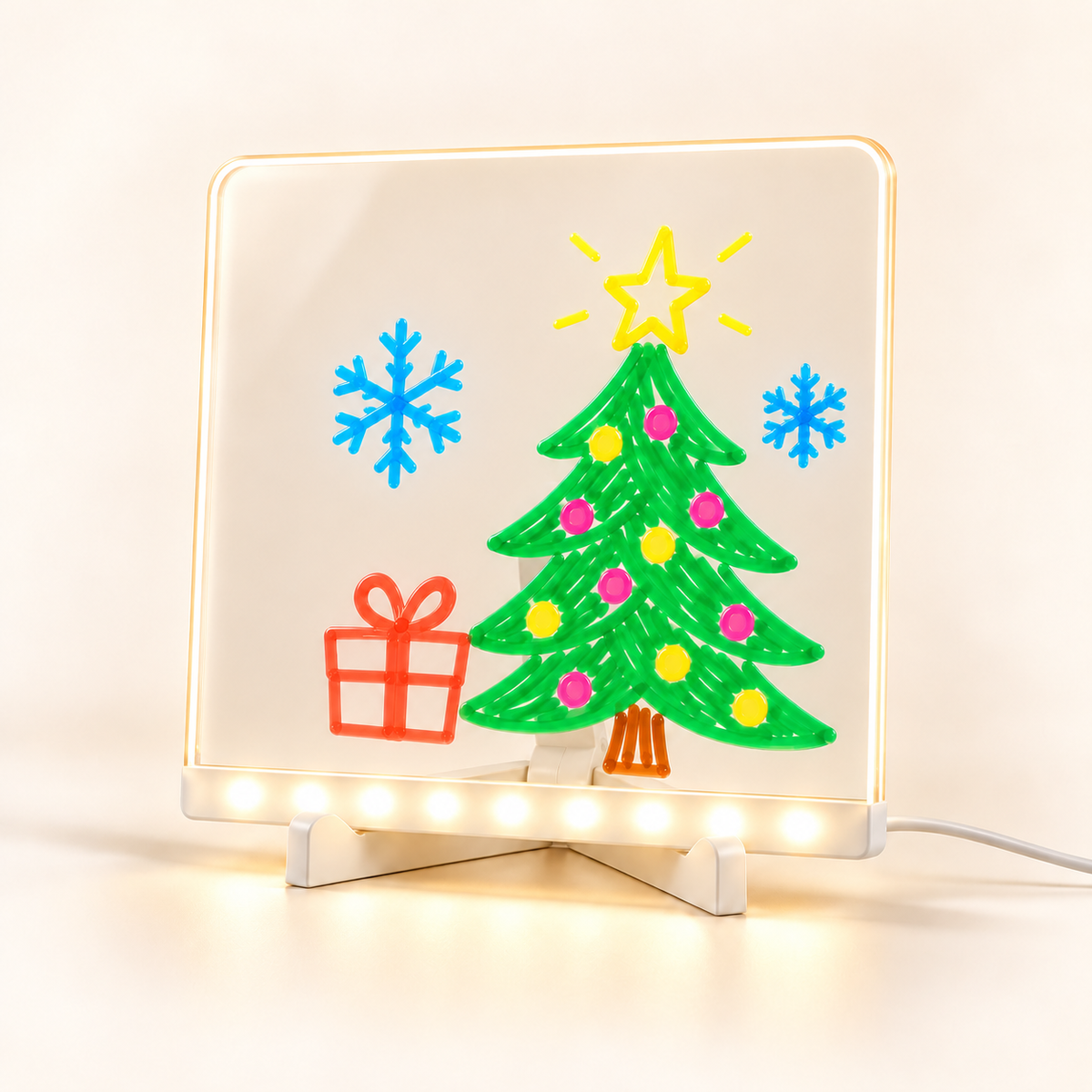 Small LED drawing board concept with Christmas tree artwork