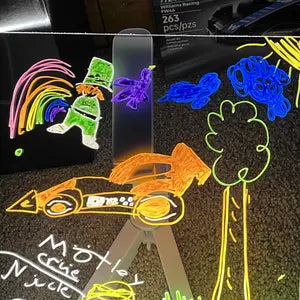 Customer photo of a glowing race car drawing on the LED board