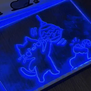 Customer photo of glowing blue cat doodles on the LED board
