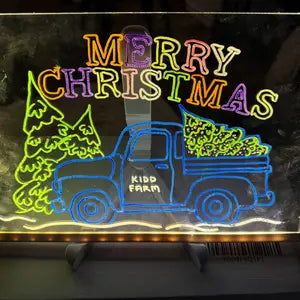 Customer photo of a glowing Merry Christmas truck drawing