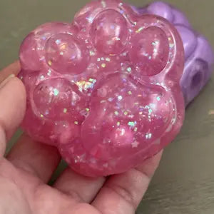 Customer photo of a glittery cat-paw squishy